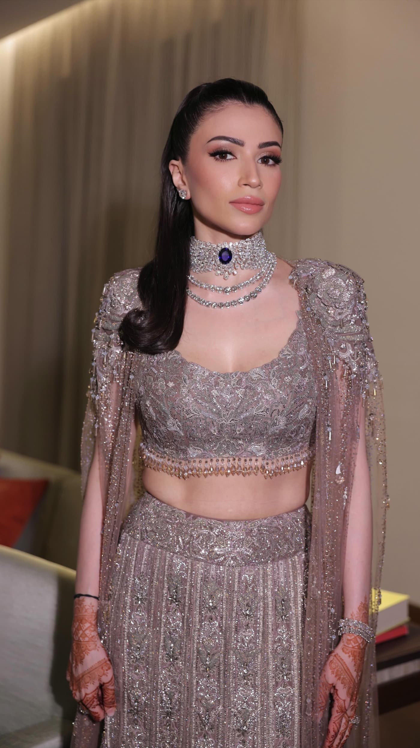 Bride-to-be in champagne couture at her cocktail night — makeup by Sneha Chowdhary