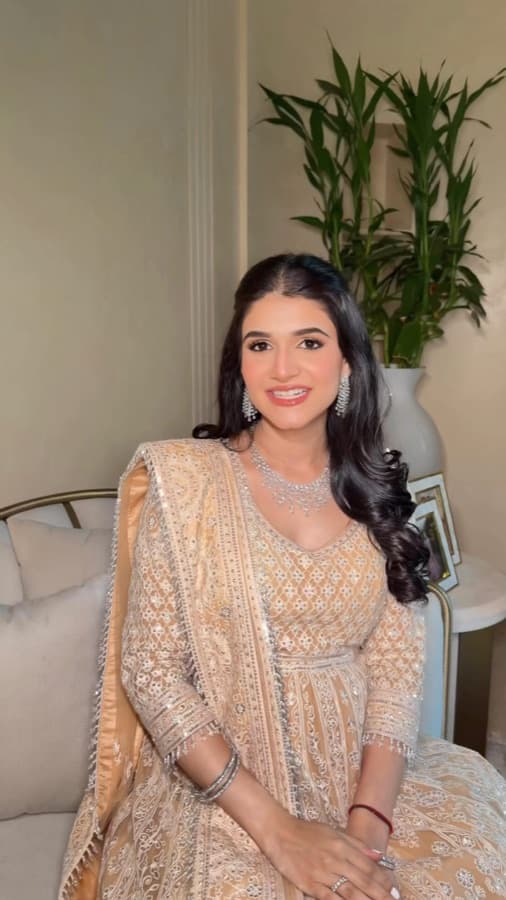 Radiant occasion look by Sneha Chowdhary — luminous skin, soft focus on the eyes